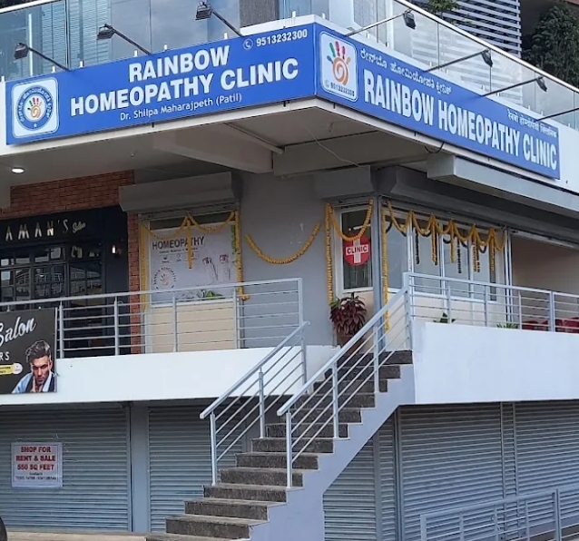 Rainbow Homeopathy Clinic building with signboards, near Belgaum Church, Belagavi